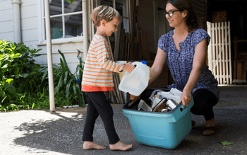 Woman and child collecting recyclables
