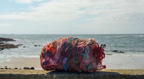 Plastic litter sitting on beach