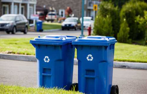 two blue recycling bins