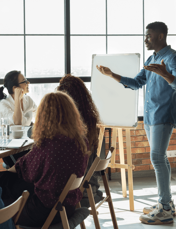 Colleagues discussing a project during a meeting