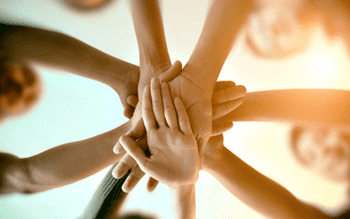 Group of people with their hands together